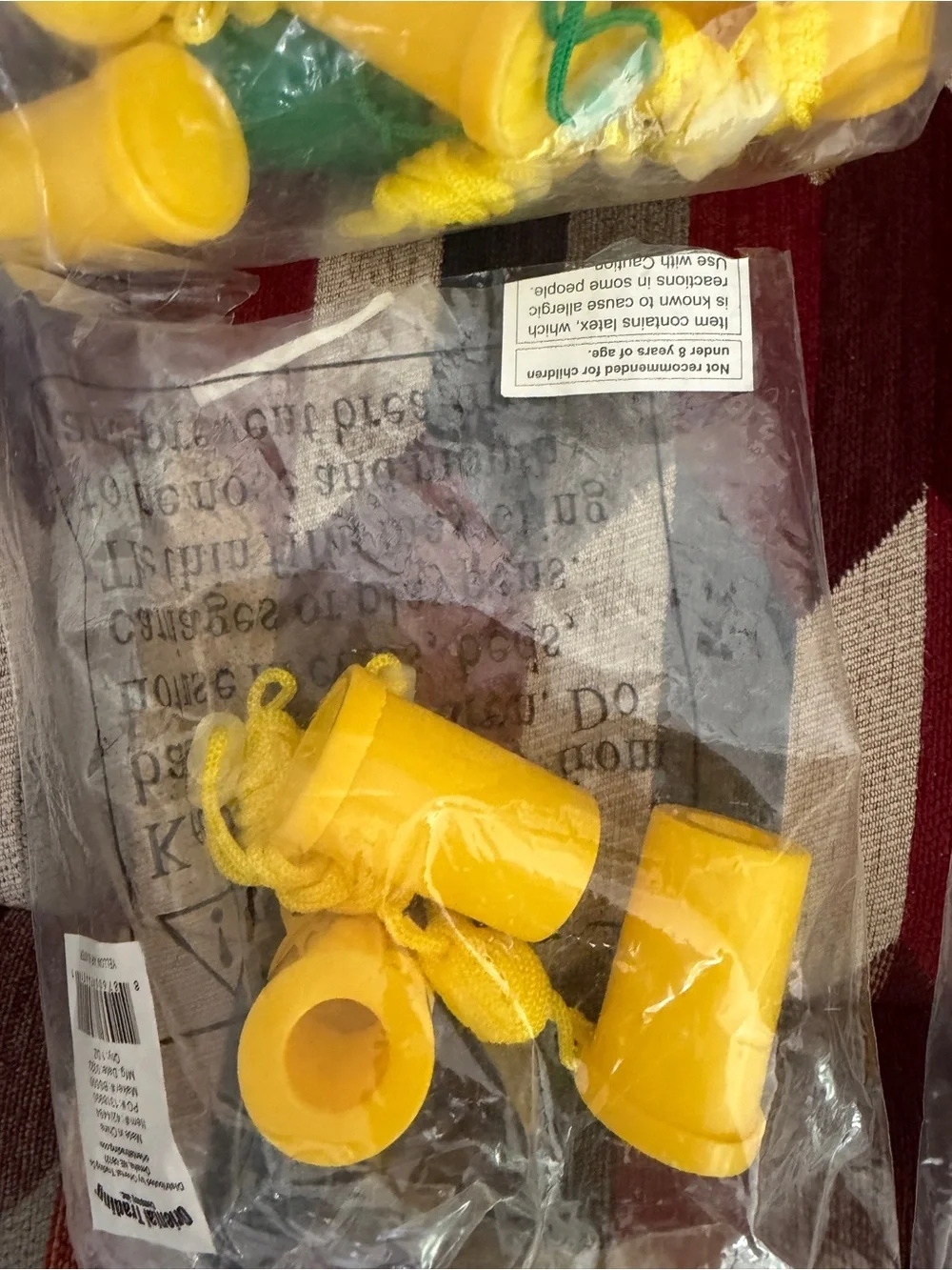 Assorted Yellow and Purple Plastic whistles